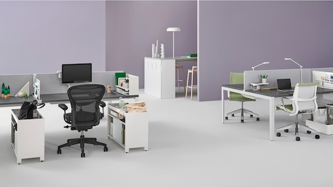 Individual Layout Studio individual workstations with Black Aeron Chairs and green upholstered Setu Chairs, with personal items and task lighting. Individual Layout Studio individual workstations with Black Aeron Chairs and green upholstered Setu Chairs, with personal items and task lighting.