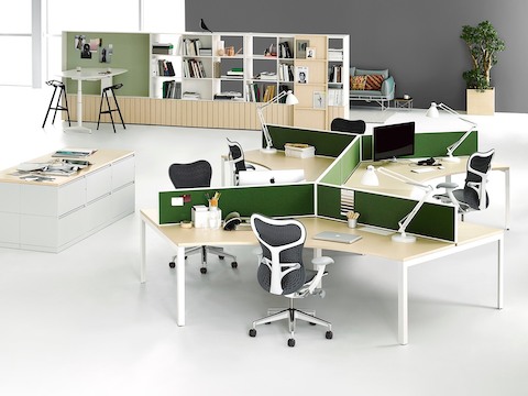 Angled Layout Studio workstations with green dividing screens, Gray Mirra 2 Chairs, and green dividing screens near lateral file storage. Angled Layout Studio workstations with green dividing screens, Gray Mirra 2 Chairs, and green dividing screens near lateral file storage.