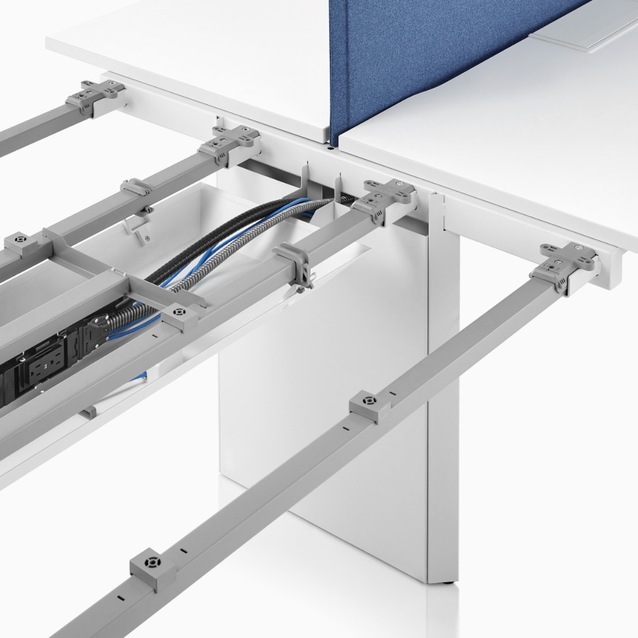 Close-up of the power and data cable management and beams found within the structure of a Layout Studio bench.