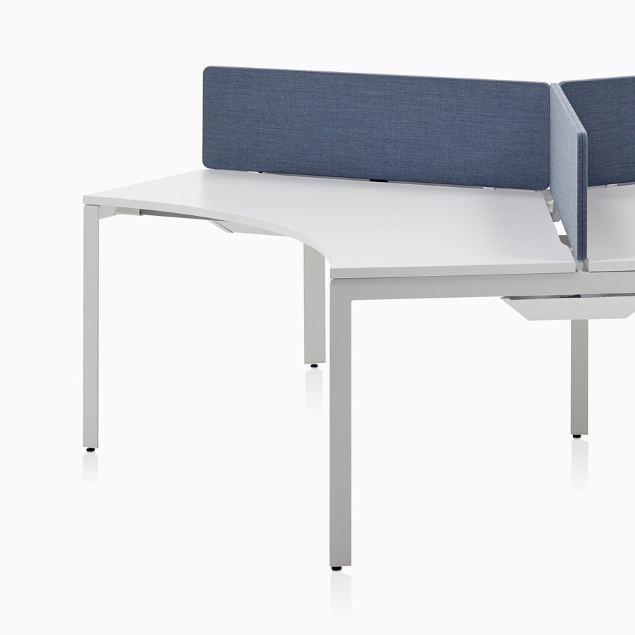 Three-person, 120-degree Layout Studio desk cluster with blue divider screen.