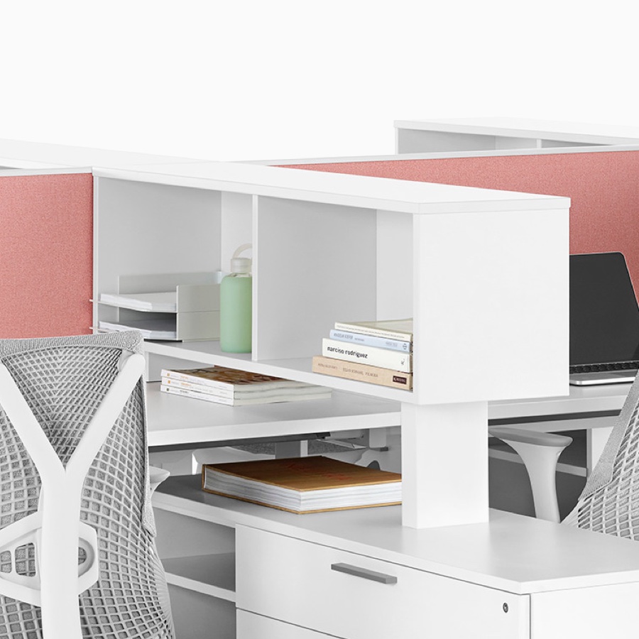 White Tu Wood credenzas and cubbies installed on a Layout Studio bench with four Sayl Chairs and a white Tu Wood bookcase placed at the end of run.