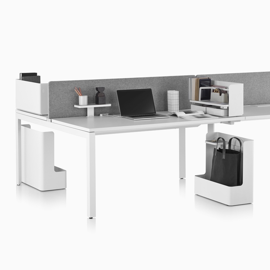 White Ubi Work Tools with a Layout Studio bench. Ubi Organizers and Ubi Shelf are on top of the surface. Ubi Mobile Bag Catches are below the surface.