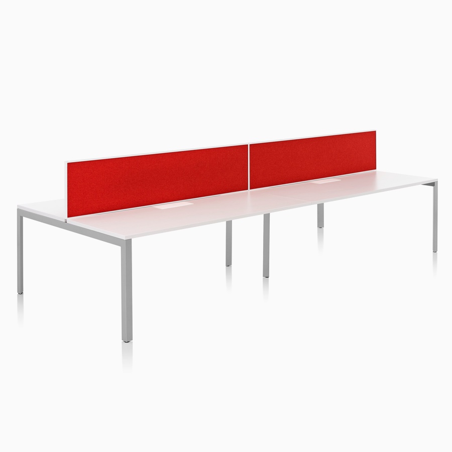 A Layout Studio bench for four with a white laminate top, gray legs, and red framed fabric center privacy screens.