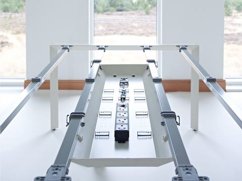 A Layout Studio work surface with the top removed, showing power and cable management features built into the understructure.