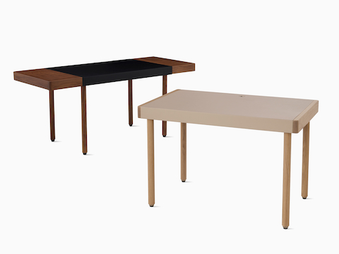 Two Leatherwrap Sit-to-Stand Desks in walnut and oak finishes, viewed at an angle.