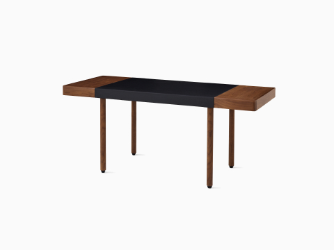 Leatherwrap Sit-to-Stand Desk in walnut and black leather, two drawers, angled view. Leatherwrap Sit-to-Stand Desk in walnut and black leather, two drawers, angled view.