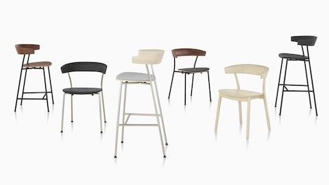 A grouping of Leeway Chairs and stools showcasing the various base materials, finishes, and upholstery options.