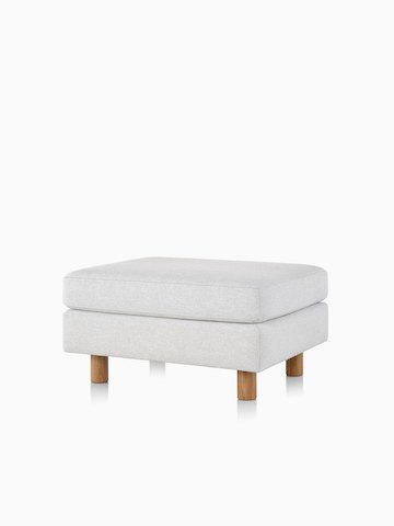 A light grey Lispenard ottoman with fabric upholstery and light wood legs, viewed from the front.