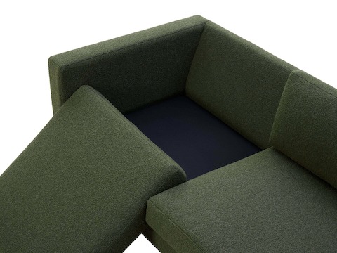 Removable cushion view of three seater Lispenard Sofa, 17 inches in dark green textile and 6 inch walnut legs.