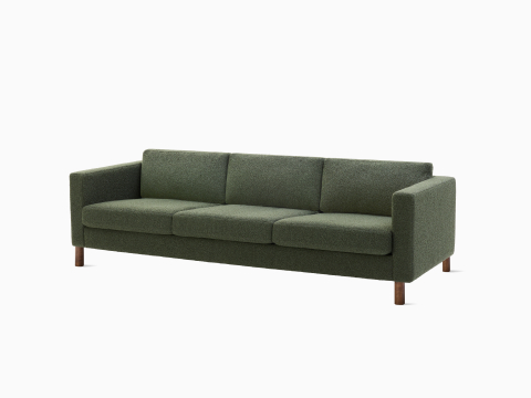 Three-seater Lispenard Sofa, 431.8 mm in dark green textile and 152.4 mm walnut legs.