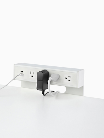 USB-A port and cable, USB-C port, and four A/C power outlets with two cables plugged into an attached table power source. Select to go to the Logic C1000 product page.