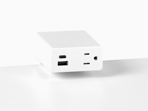 Close up image of a white surface mounted Logic Mini with two USB ports and one simplex receptacle.