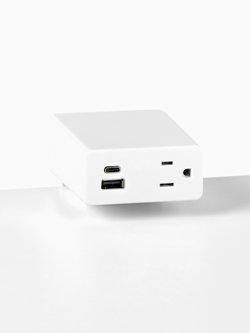 Close up image of a white surface mounted Logic Mini with two USB ports and one simplex receptacle. Select to go to the Logic Mini product page.
