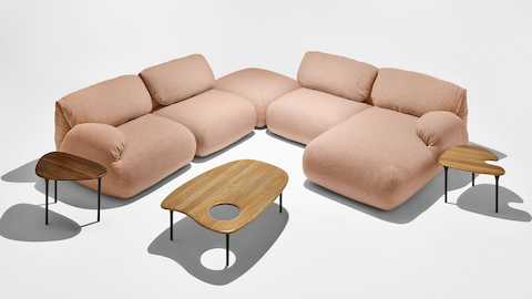 Luva Sofa as a corner sectional with Cyclade Tables.