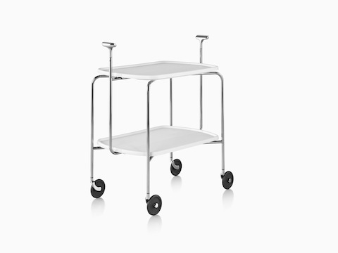 Angled view of a Magis Transit Folding Trolley cart with two white shelves, a steel frame, polished aluminum handles, and casters.