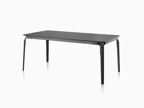 An angled view of a rectangular Magis Steelwood Table with a black top and legs. 