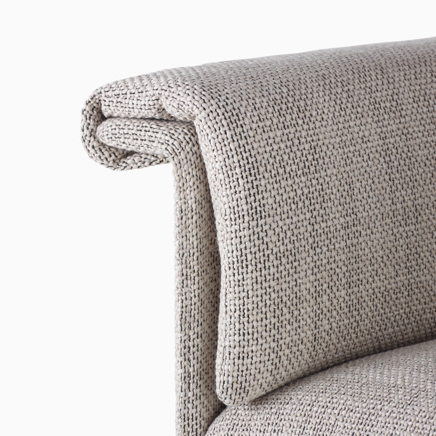 A detailed view of a Mantle Club Chair with an overlay cushion upholstered in Capri Stone.
