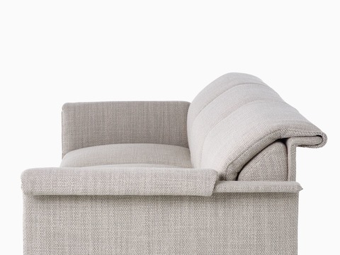 Cropped side view of a Mantle Three-Seater Sofa upholstered in Capri Stone.