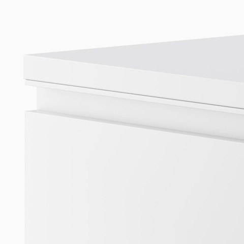 Close up image of a white Meridian Storage lateral file, with standard pulls.