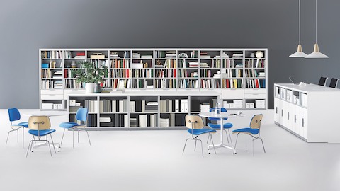 Meridian storage units divide space, provide work surface, and accommodate a corporate library. 
