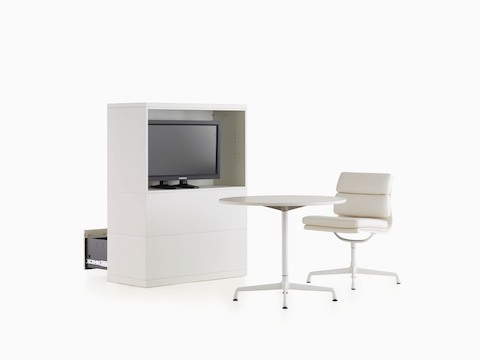 Stackable Meridian storage modules with lateral files facing one way and a media cabinet facing the other. 