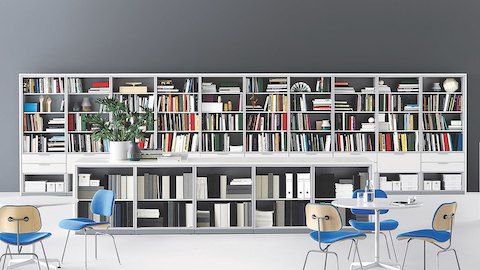 Meridian Storage units divide an open workspace, provide work surfaces, and are used to accommodate a corporate library.