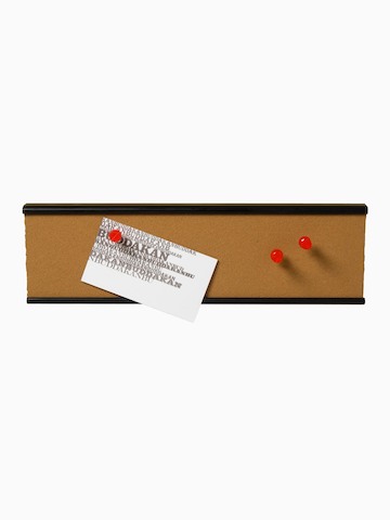 A narrow tackboard with a note and three pins attached. Select to go to the Mini-Tackboard product page.