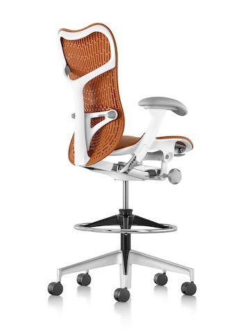 Three-quarter rear view of an orange Mirra 2 Stool. Three-quarter rear view of an orange Mirra 2 Stool.