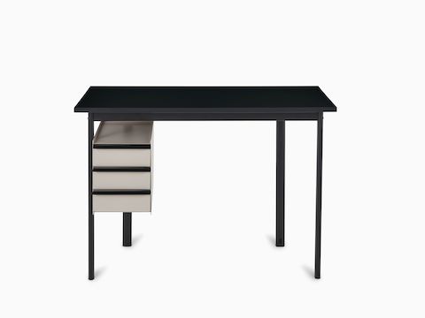 Mode-bureau met een zwart tafelblad en lades in zandsteenkleur.