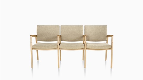 Three-seat Monarch Multiple Seating with beige upholstery, a solid maple frame, and intervening arms.