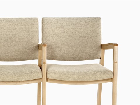 Partial view of beige Monarch Multiple Seating, showing the sculpted wood arms and memory foam seat. Partial view of beige Monarch Multiple Seating, showing the sculpted wood arms and memory foam seat.