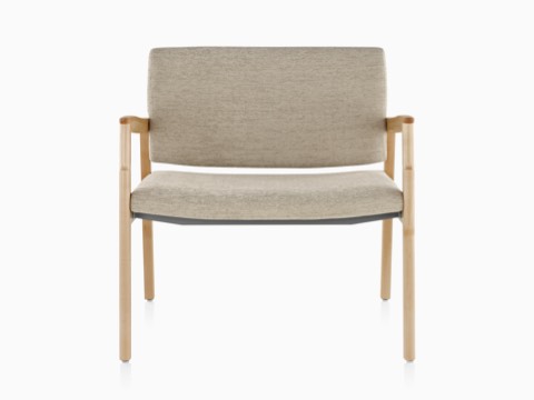 A Monarch Plus chair with a wide seat, beige upholstery, and solid maple frame. A Monarch Plus chair with a wide seat, beige upholstery, and solid maple frame.
