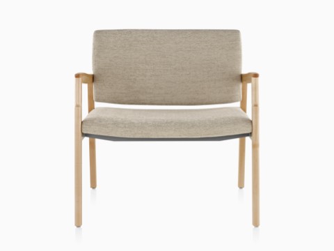 A Monarch Plus chair with a wide seat, beige upholstery, and solid maple frame.