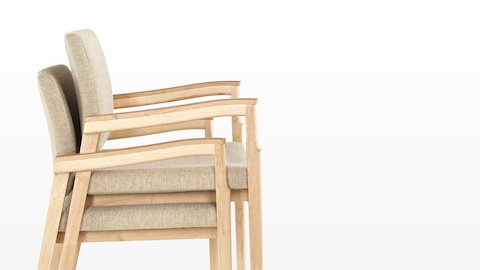 Profile view of beige Monarch chairs stacked two-high. Profile view of beige Monarch chairs stacked two-high.