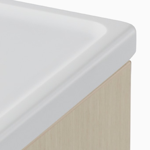 A close-up view of the Mora cart integrated top surface featuring the grooved edge.