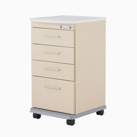A Mora casework four-drawer supply cart in a light ash finish and a white solid surface top.