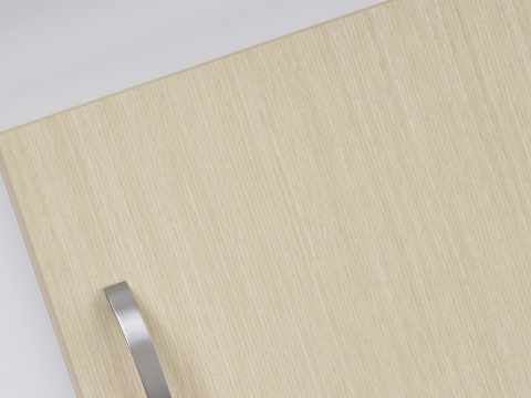 A close-up view of Mora Casework materials, with a panel in a light ash finish and a white Corian countertop surface.
