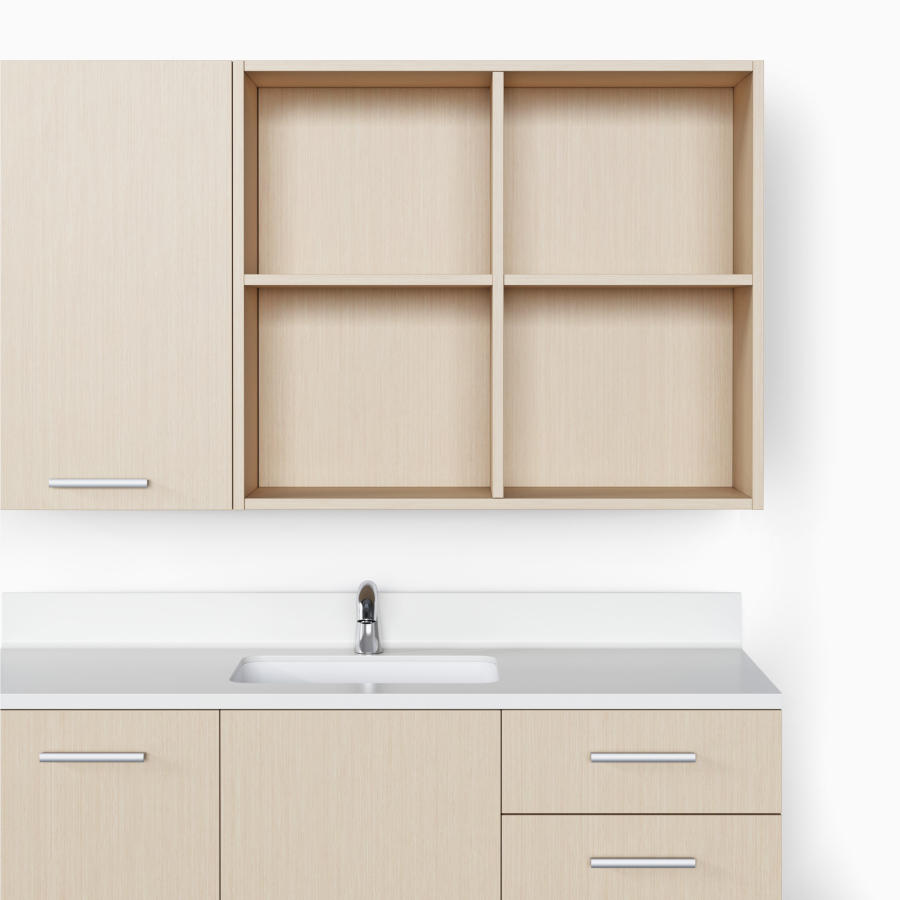 Mora Casework with an open, divided upper storage unit and a lower storage unit in an ash wood finish.