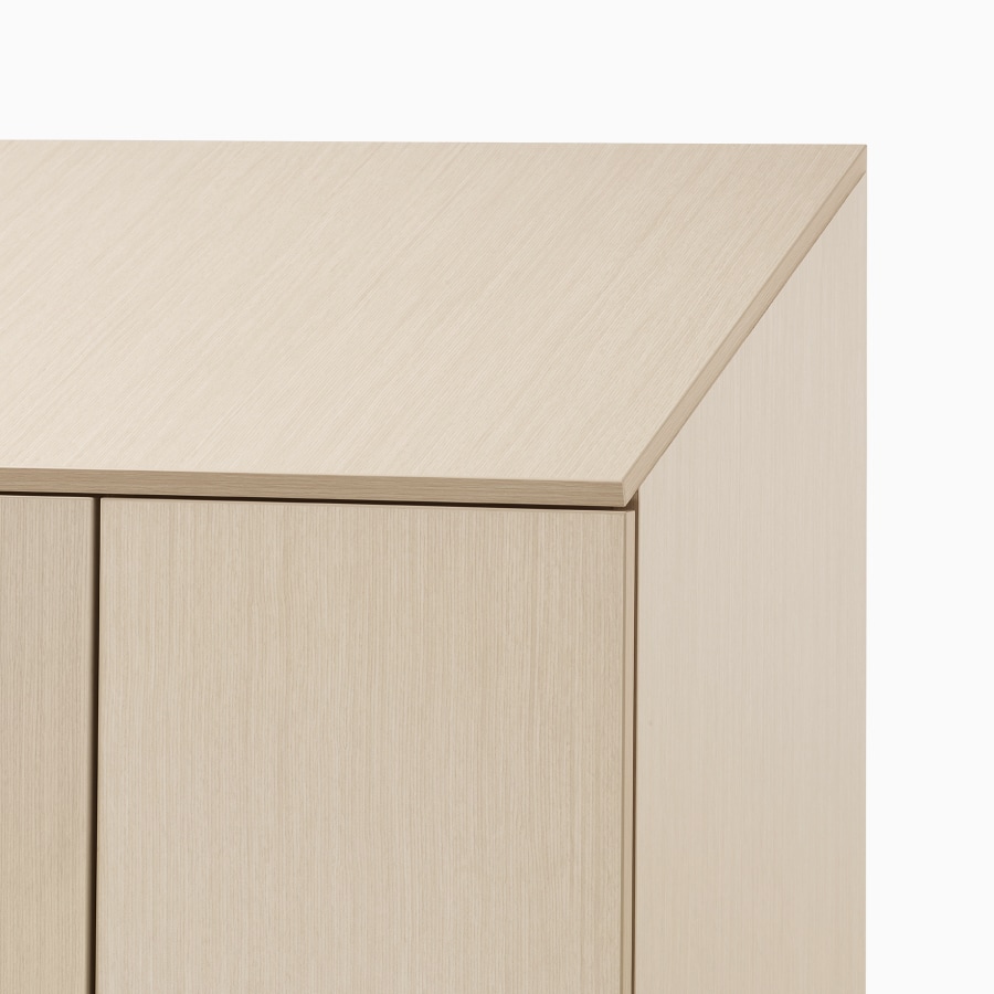 A close-up view of Mora Casework in a light wood finish with a sloped top for better cleaning.