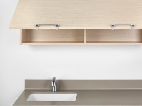 Mora System overhead storage mounted above a sink. 