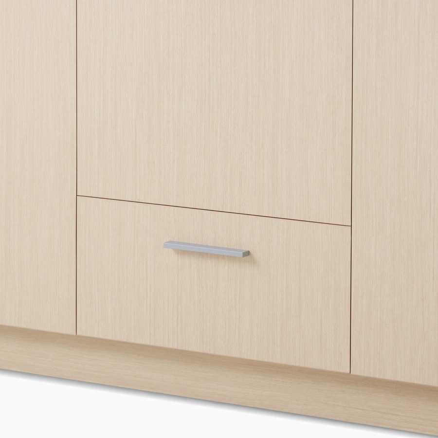 A close-up view of a Mora System casework storage cabinet in a light wood finish.
