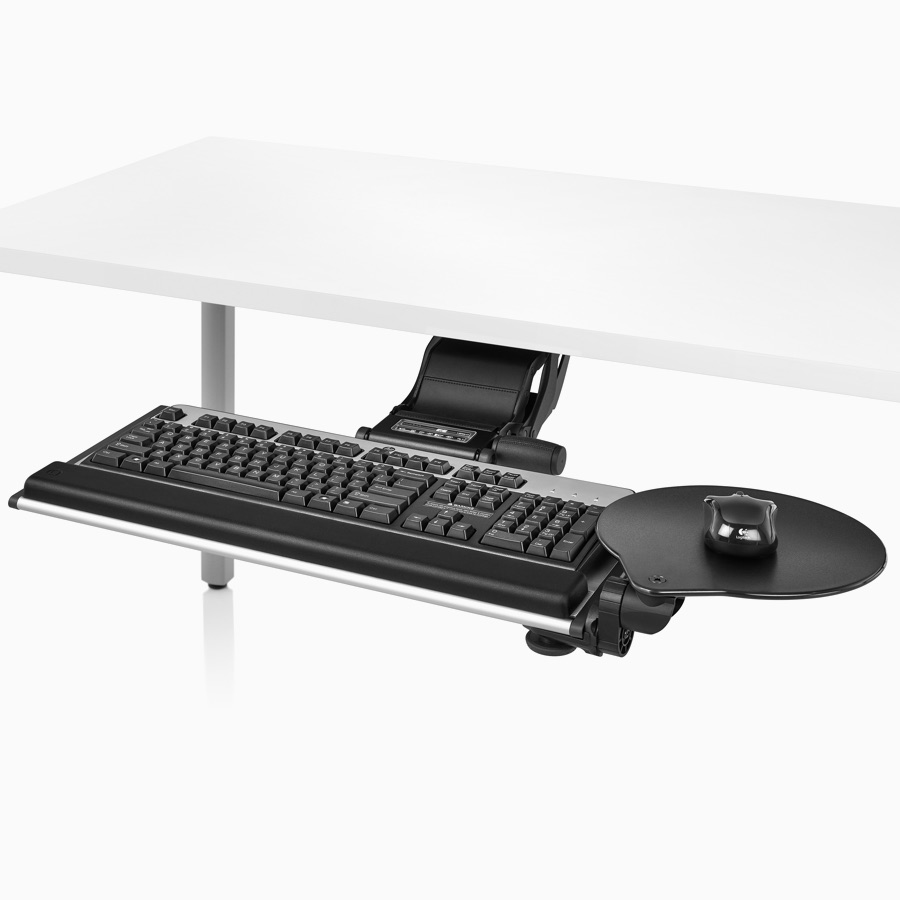 Viewed at an angle, a Keyboard Support, TL Series, with an attached mouse platform extended out beneath an Everywhere Table.