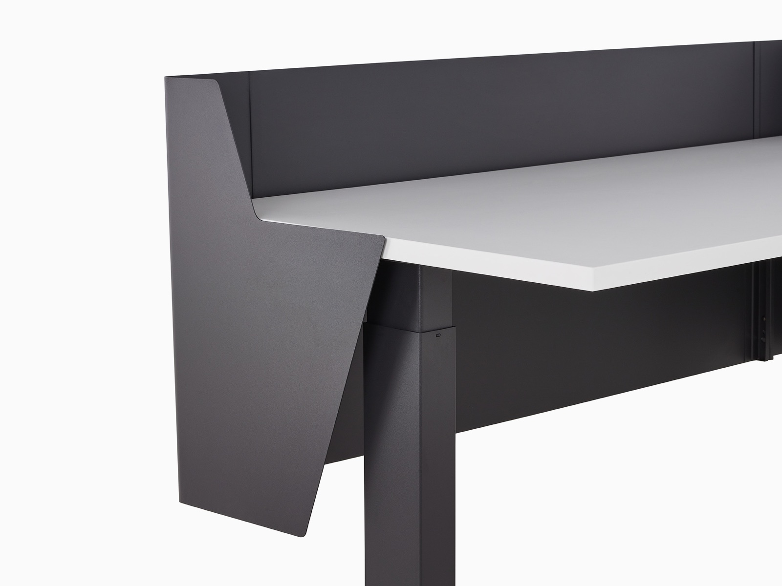 Close-up of a wrapped black metal privacy screen attached to a Motia Sit-To-Stand Table.