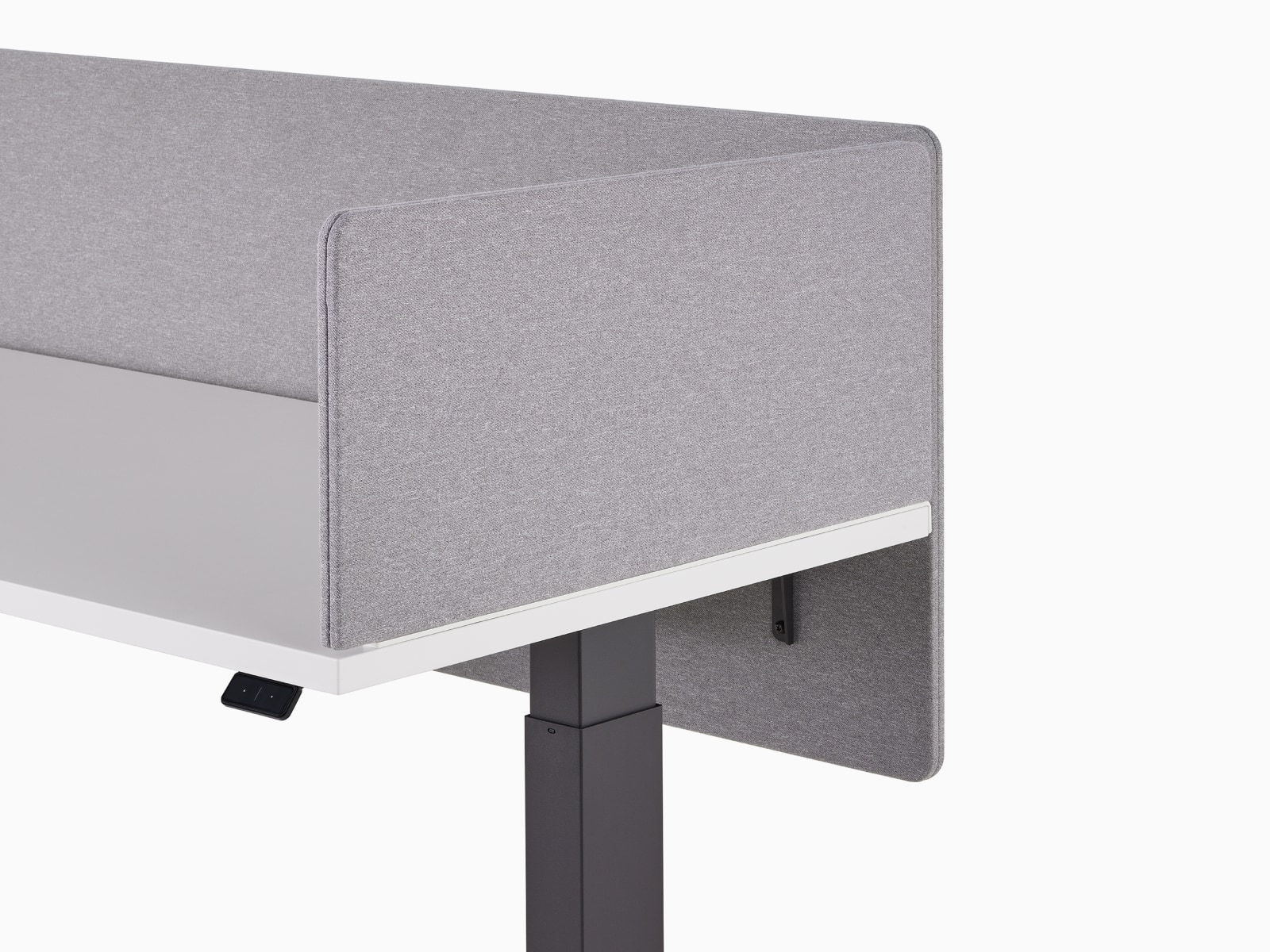 Close-up of a gray fabric, delineation side screen on a Motia Sit-To-Stand Table with a gray fabric, surface-attached privacy screen.