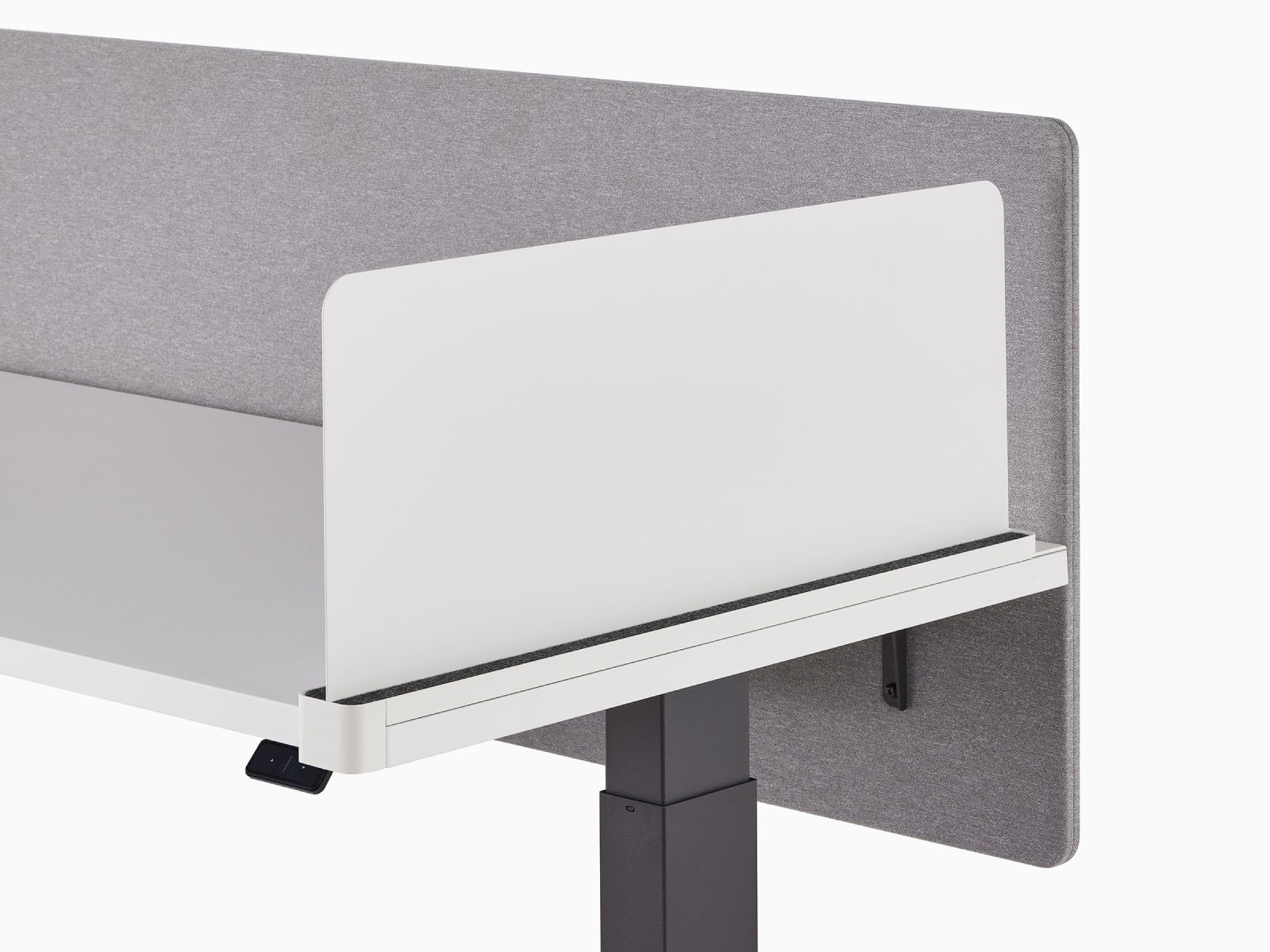 Close-up of a white Ubi slim metal delineation side screen with a surface attached gray privacy screen on a Motia Sit-to-Stand Table.