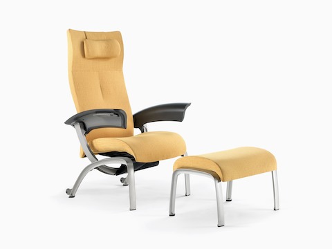 A mustard-coloured Nala Patient Chair and ottoman, viewed from a 45-degree angle.