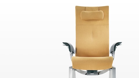 The seat and back of a mustard-colored Nala Patient Chair, viewed from the front.
