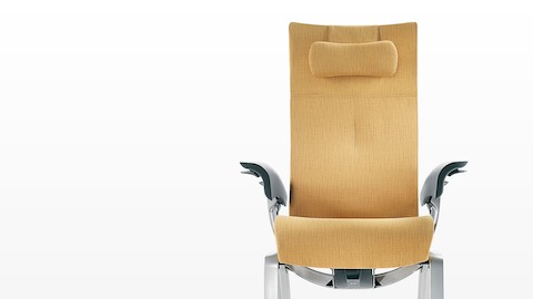 The seat and back of a mustard-colored Nala Patient Chair, viewed from the front. The seat and back of a mustard-colored Nala Patient Chair, viewed from the front.