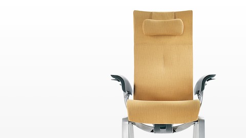 The seat and back of a mustard-coloured Nala Patient Chair, viewed from the front.