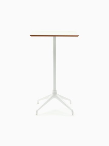Una mesa Ali con altura de bar, con base de estrella de 4 puntas en blanco y superficie en blanco.
